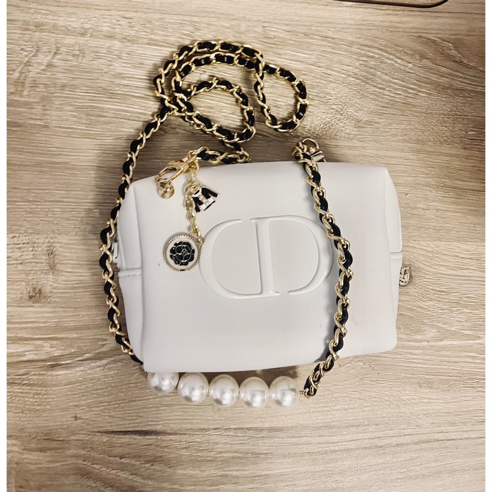 - Dior cosmetic bag/pouch to crossbody bag